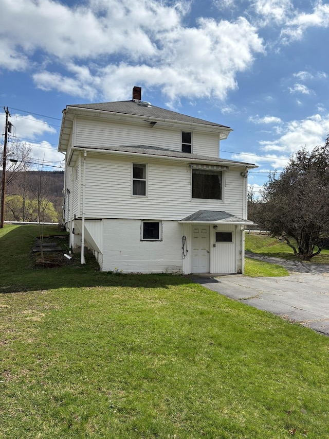 23 Riverside Dr, Roscoe, NY 12776 - back of property with a chimney and a yard
