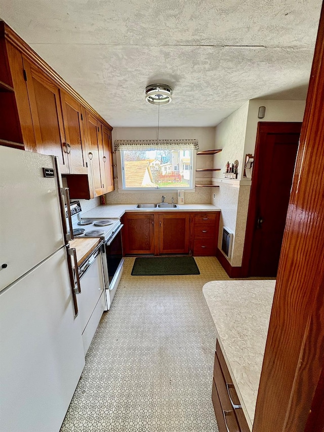 23 Riverside Dr, Roscoe, NY 12776 - kitchen featuring open shelves, light countertops, white appliances, and a sink