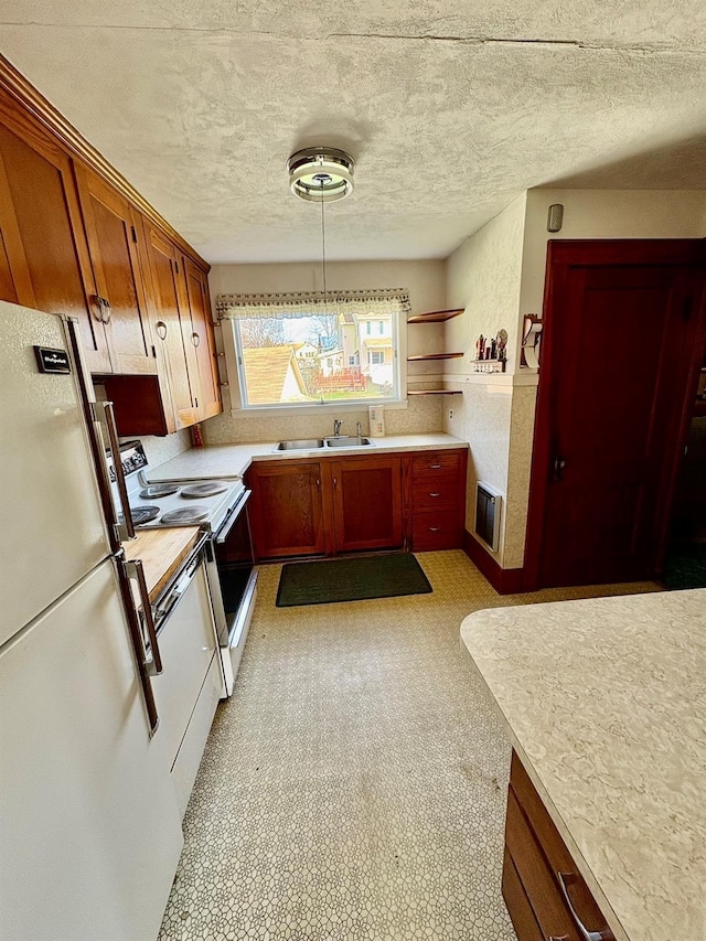 23 Riverside Dr, Roscoe, NY 12776 - kitchen with a textured ceiling, a sink, white appliances, and light countertops