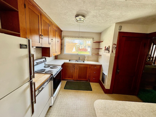 23 Riverside Dr, Roscoe, NY 12776 - kitchen featuring a sink, white appliances, open shelves, light countertops, and a textured ceiling