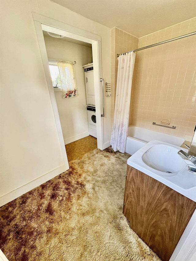 23 Riverside Dr, Roscoe, NY 12776 - bathroom with shower / tub combo, baseboards, stacked washing maching and dryer, and a sink