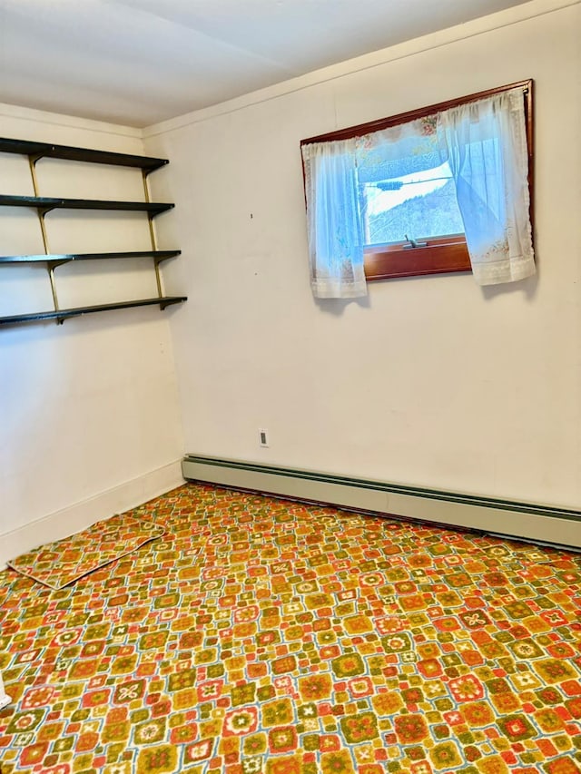 23 Riverside Dr, Roscoe, NY 12776 - unfurnished room featuring a baseboard heating unit and baseboards