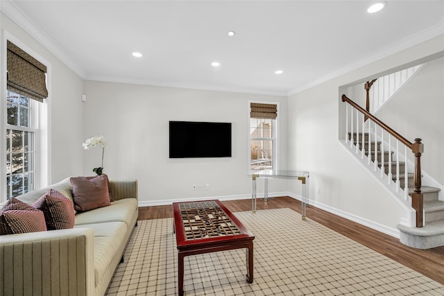 living room with hardwood / wood-style flooring and ornamental molding