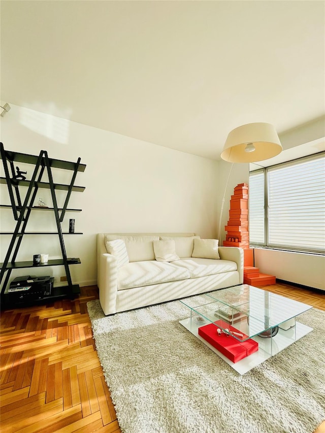 living room featuring parquet floors