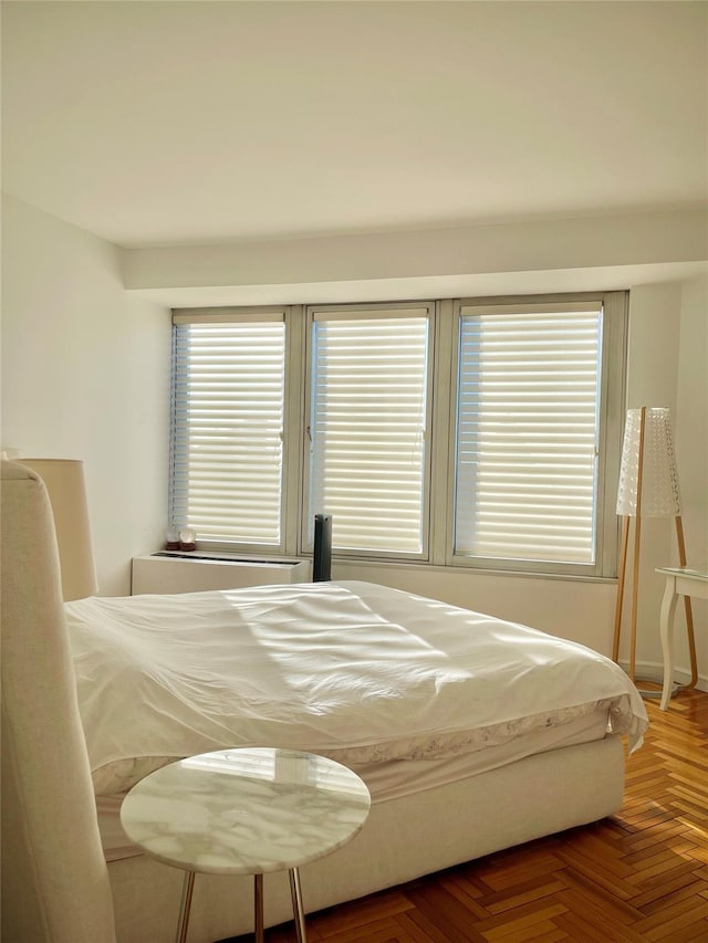 bedroom with parquet flooring