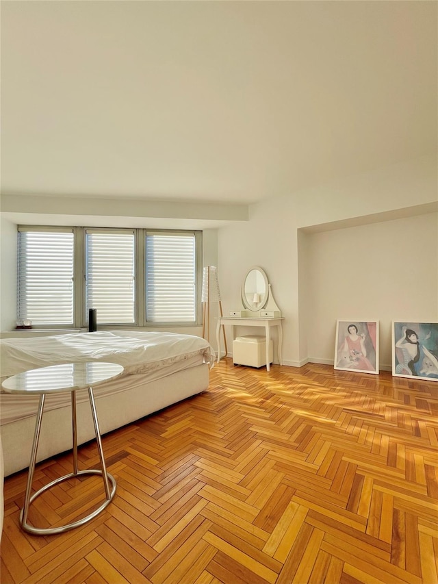 bedroom featuring light parquet flooring