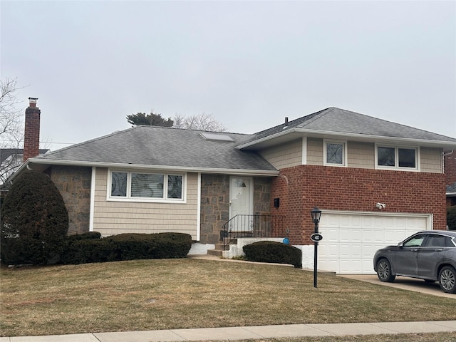 tri-level home featuring a front yard and a garage