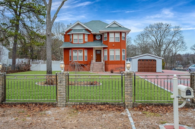 view of front facade featuring an outbuilding, a front lawn, and a garage