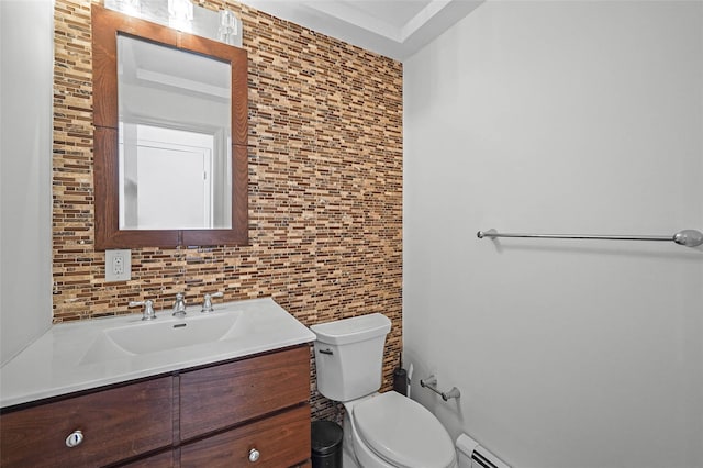 bathroom with toilet, decorative backsplash, and vanity