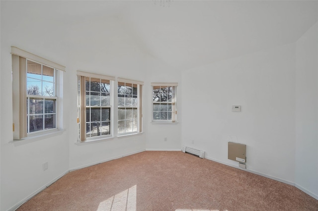 carpeted empty room featuring lofted ceiling, a baseboard radiator, baseboards, and a healthy amount of sunlight