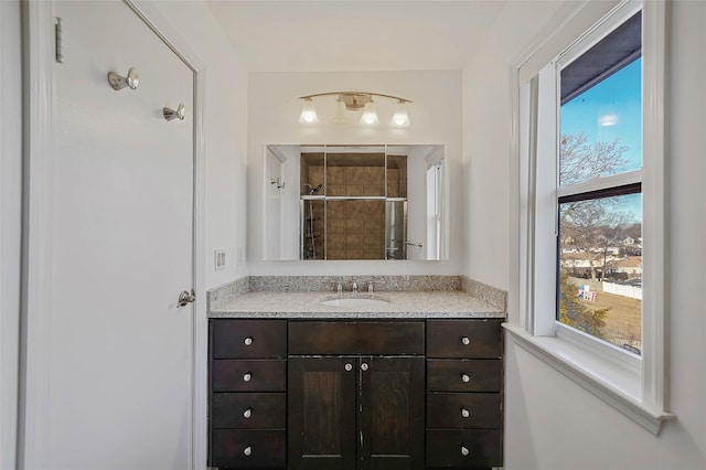 full bath featuring a shower stall and vanity