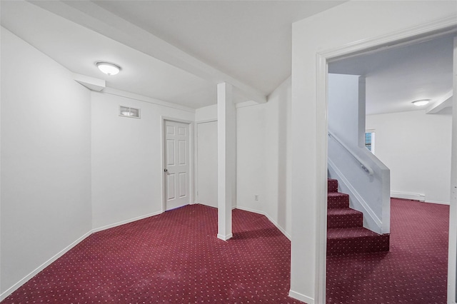 finished basement with visible vents, baseboards, a baseboard radiator, stairs, and carpet floors