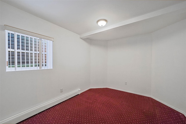 carpeted spare room with baseboards and a baseboard heating unit