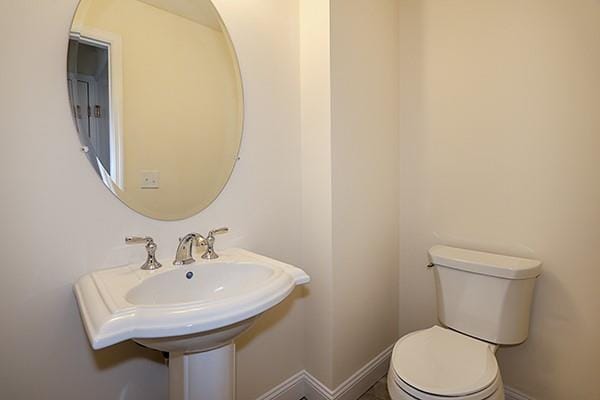 bathroom with toilet and sink