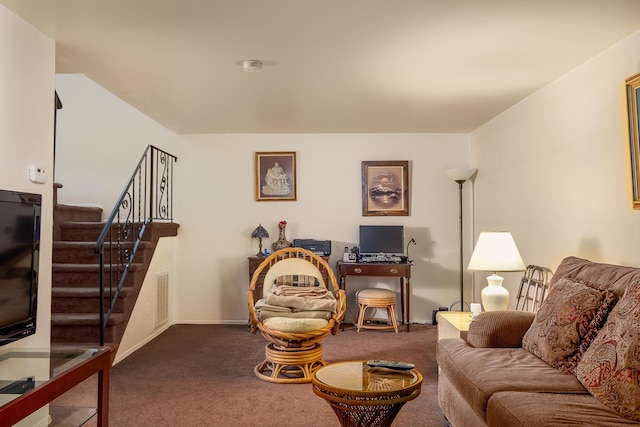 living room with dark carpet