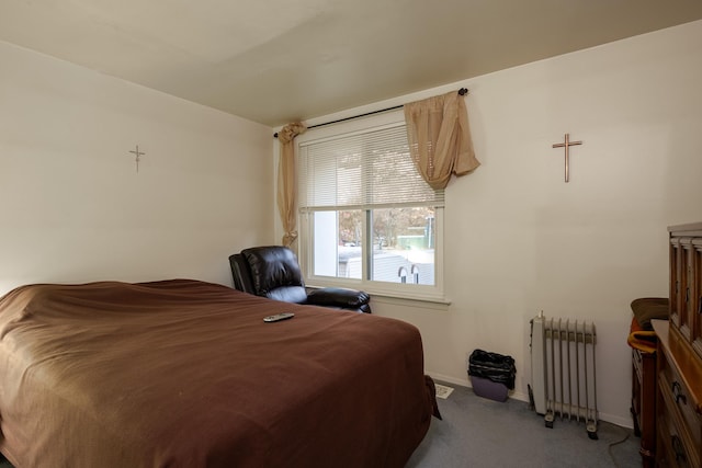 carpeted bedroom with radiator heating unit