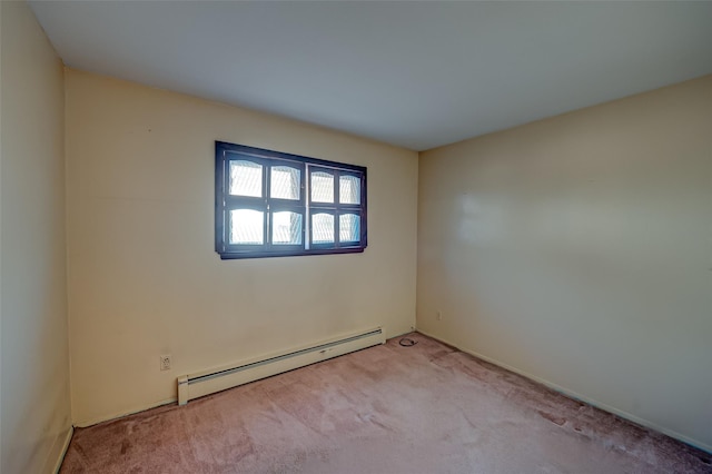 carpeted empty room with baseboard heating