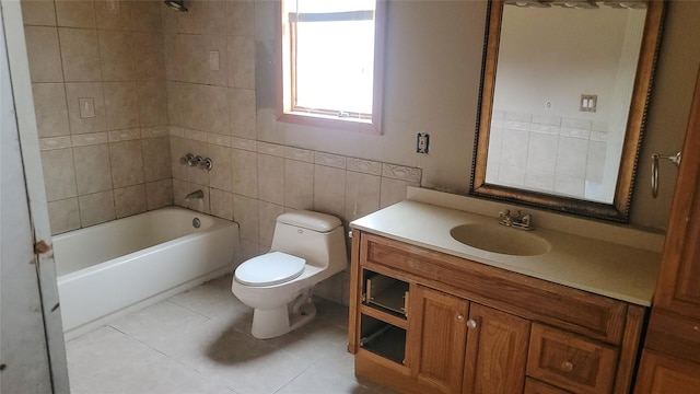 full bathroom with tiled shower / bath combo, tile patterned flooring, vanity, tile walls, and toilet