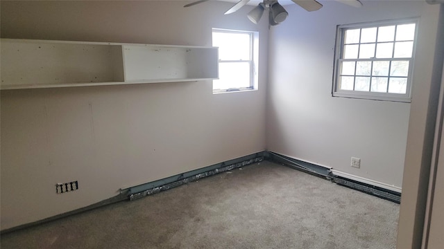 empty room featuring ceiling fan and carpet floors