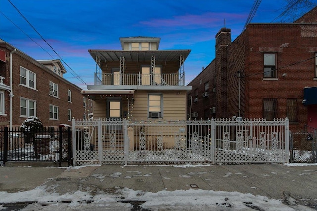 view of front facade with a balcony