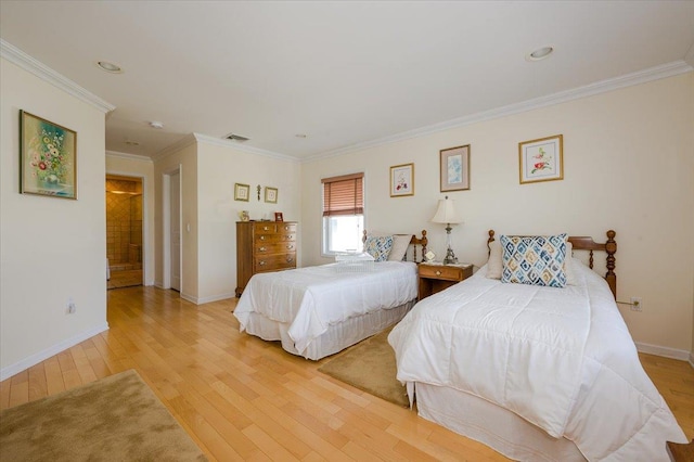 bedroom with light hardwood / wood-style floors and crown molding