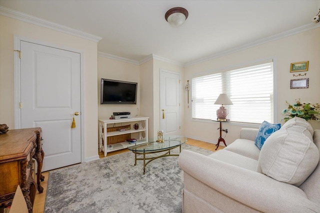 living room with light wood-type flooring and crown molding