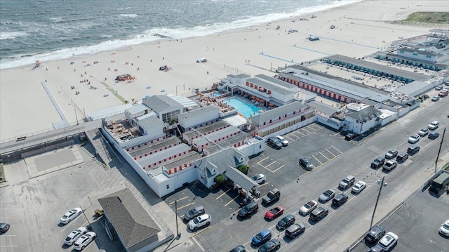 bird's eye view featuring a water view and a view of the beach