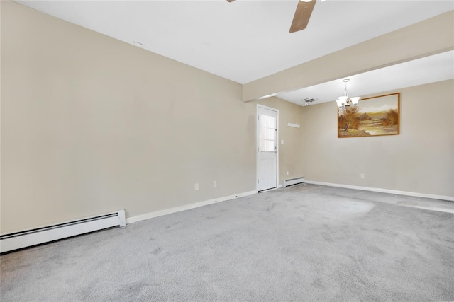 unfurnished room with a baseboard radiator, baseboards, and carpet flooring