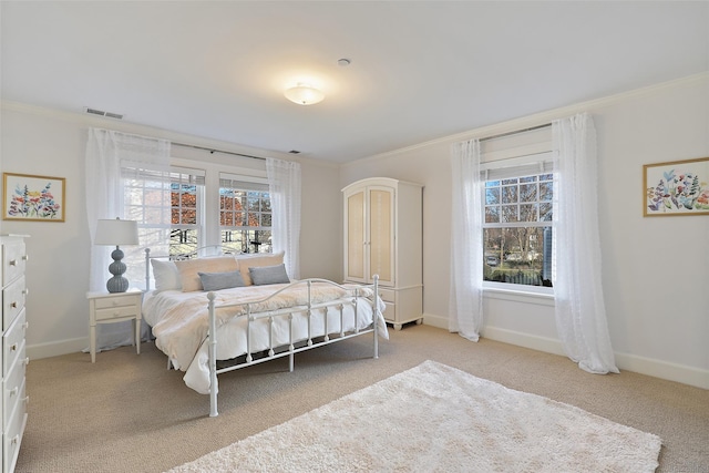 bedroom featuring light colored carpet and crown molding