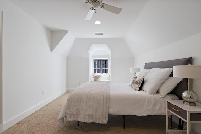 carpeted bedroom featuring lofted ceiling and ceiling fan