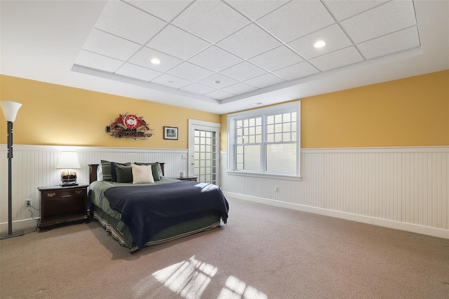 bedroom featuring carpet and a drop ceiling