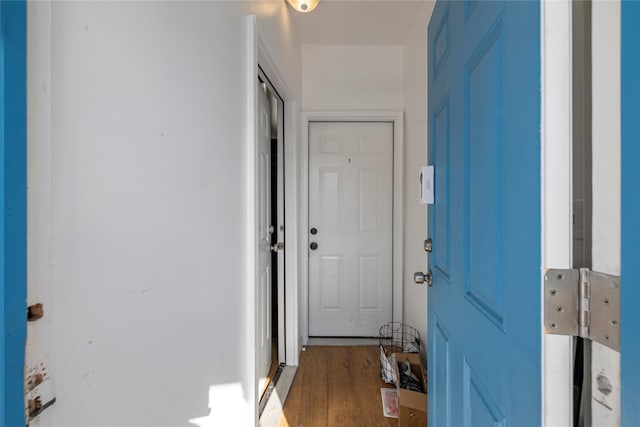 doorway with hardwood / wood-style flooring