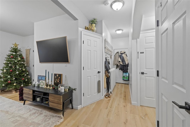 hallway with light wood-type flooring