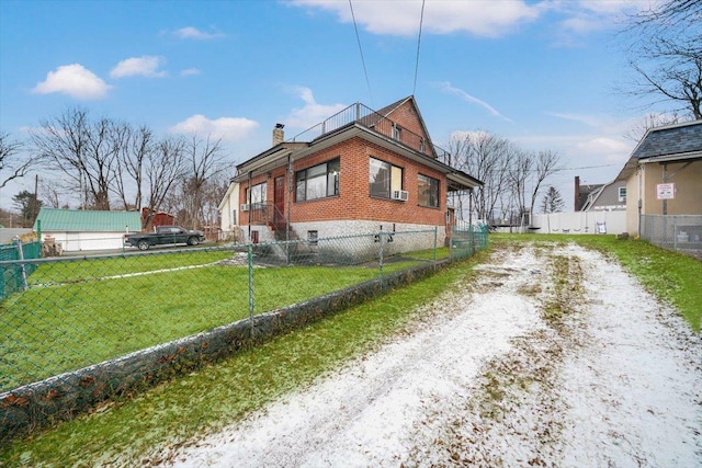 view of side of home featuring a yard