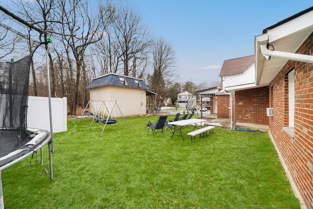 view of yard with a trampoline