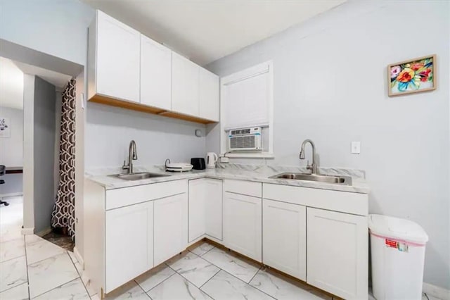 kitchen with sink and white cabinets