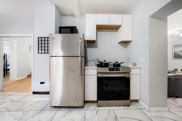 kitchen with white cabinetry and stainless steel appliances