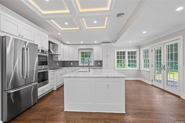 kitchen featuring white cabinets, french doors, light stone countertops, a kitchen island with sink, and appliances with stainless steel finishes