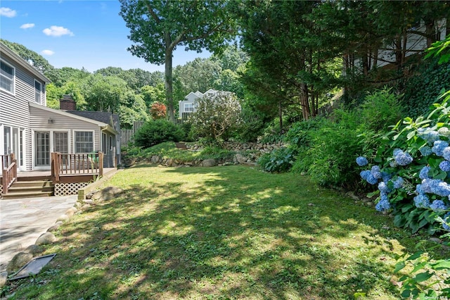 view of yard featuring a wooden deck