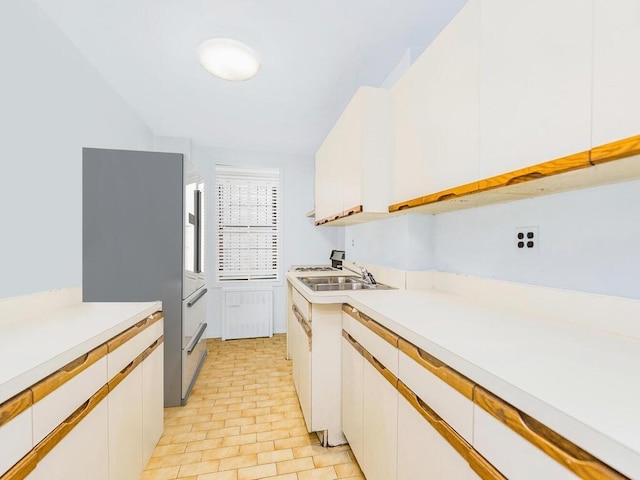 kitchen with sink and white cabinetry