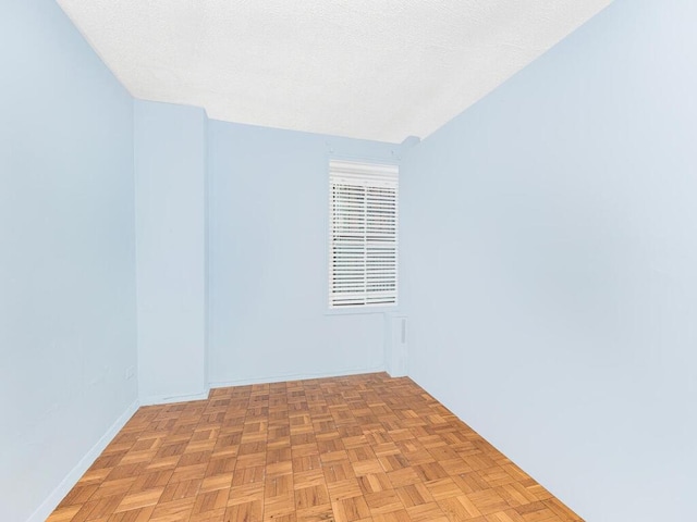 spare room featuring light parquet floors