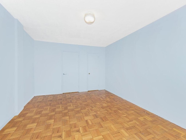 spare room featuring light parquet flooring