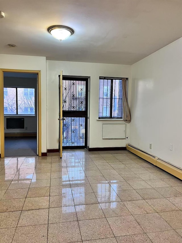 spare room with a baseboard heating unit