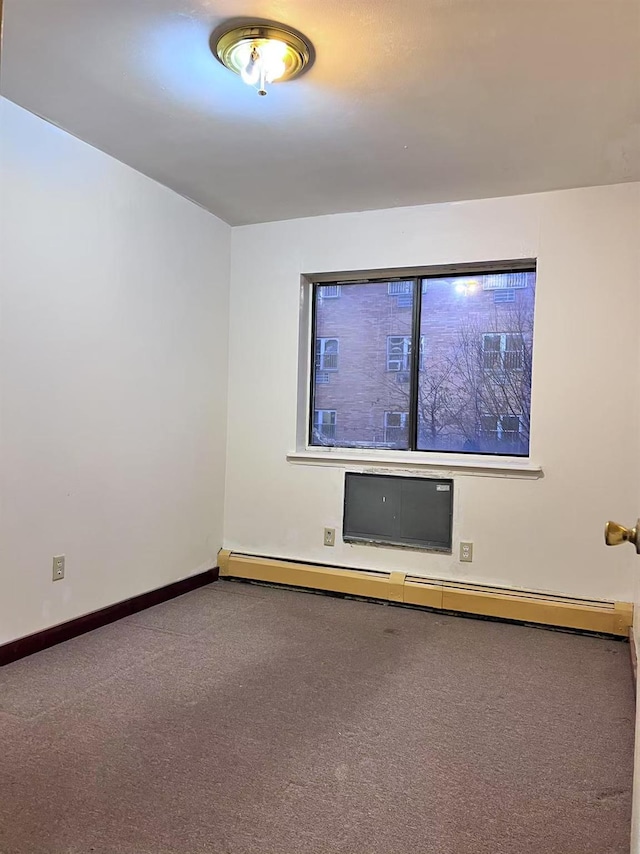 carpeted spare room featuring baseboard heating and a wall mounted AC