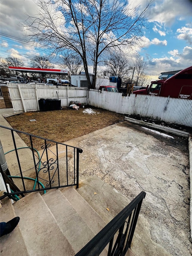 view of patio featuring fence