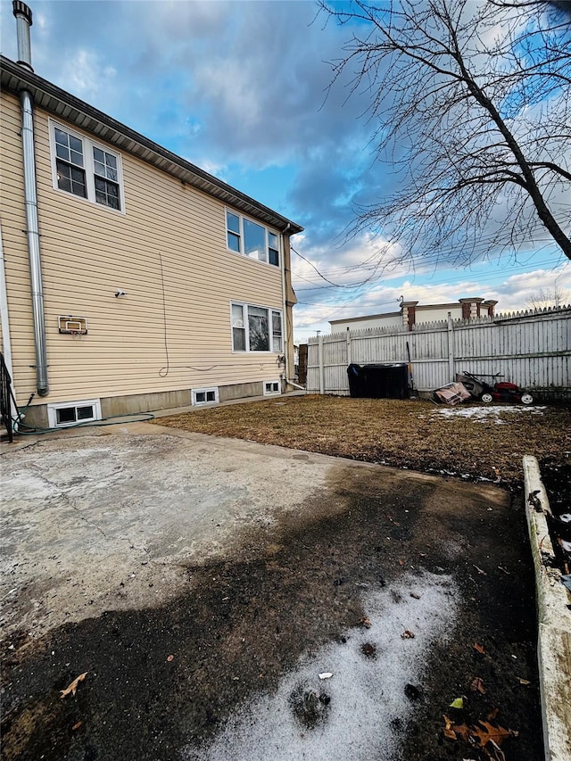 view of side of property with fence