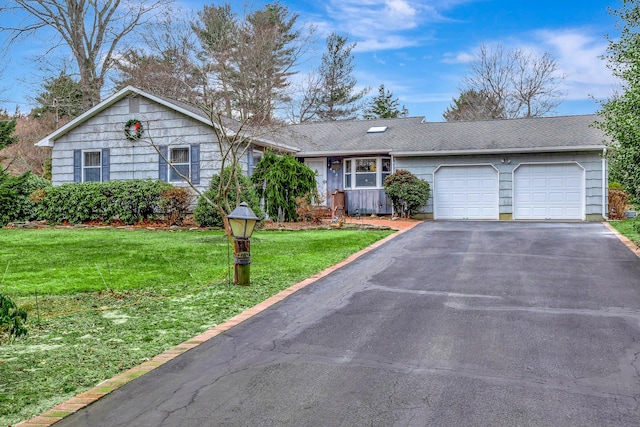 single story home with a front lawn and a garage