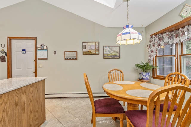 tiled dining room featuring baseboard heating and vaulted ceiling with skylight