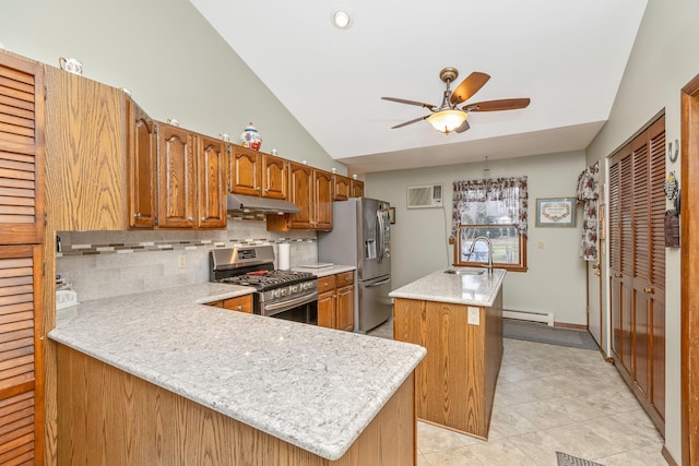 kitchen featuring appliances with stainless steel finishes, backsplash, a center island, a baseboard radiator, and sink