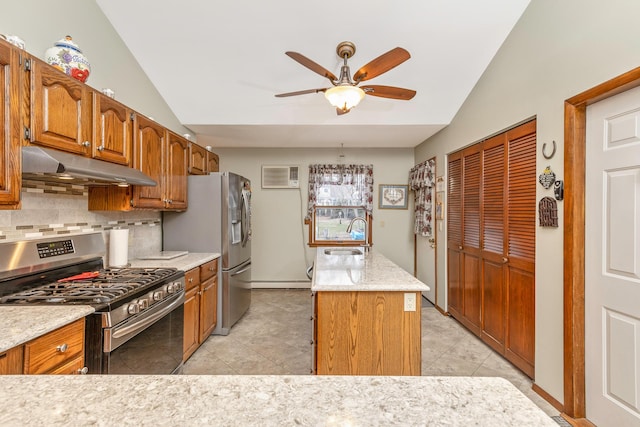 kitchen with stainless steel appliances, lofted ceiling, decorative backsplash, and sink